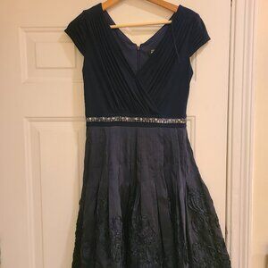 Navy blue cocktail/party dress with satin skirt and sequined bodice